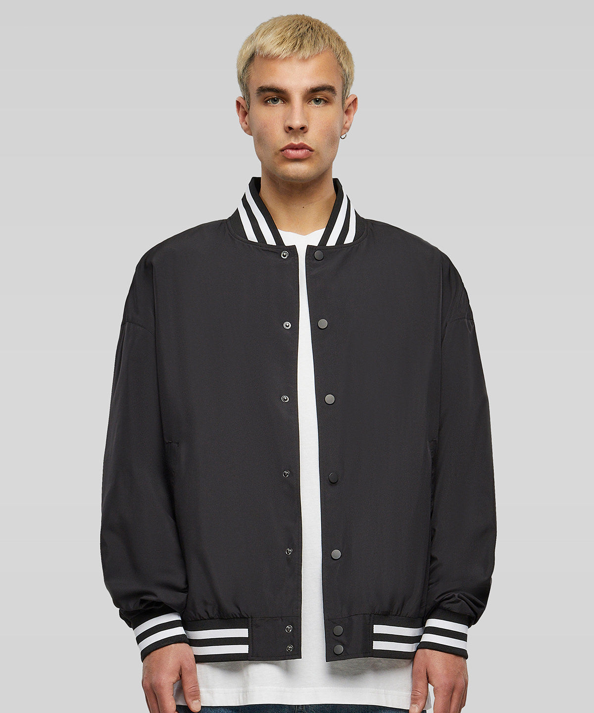 Build Your Brand Light college jacket in Black, lifestyle photo