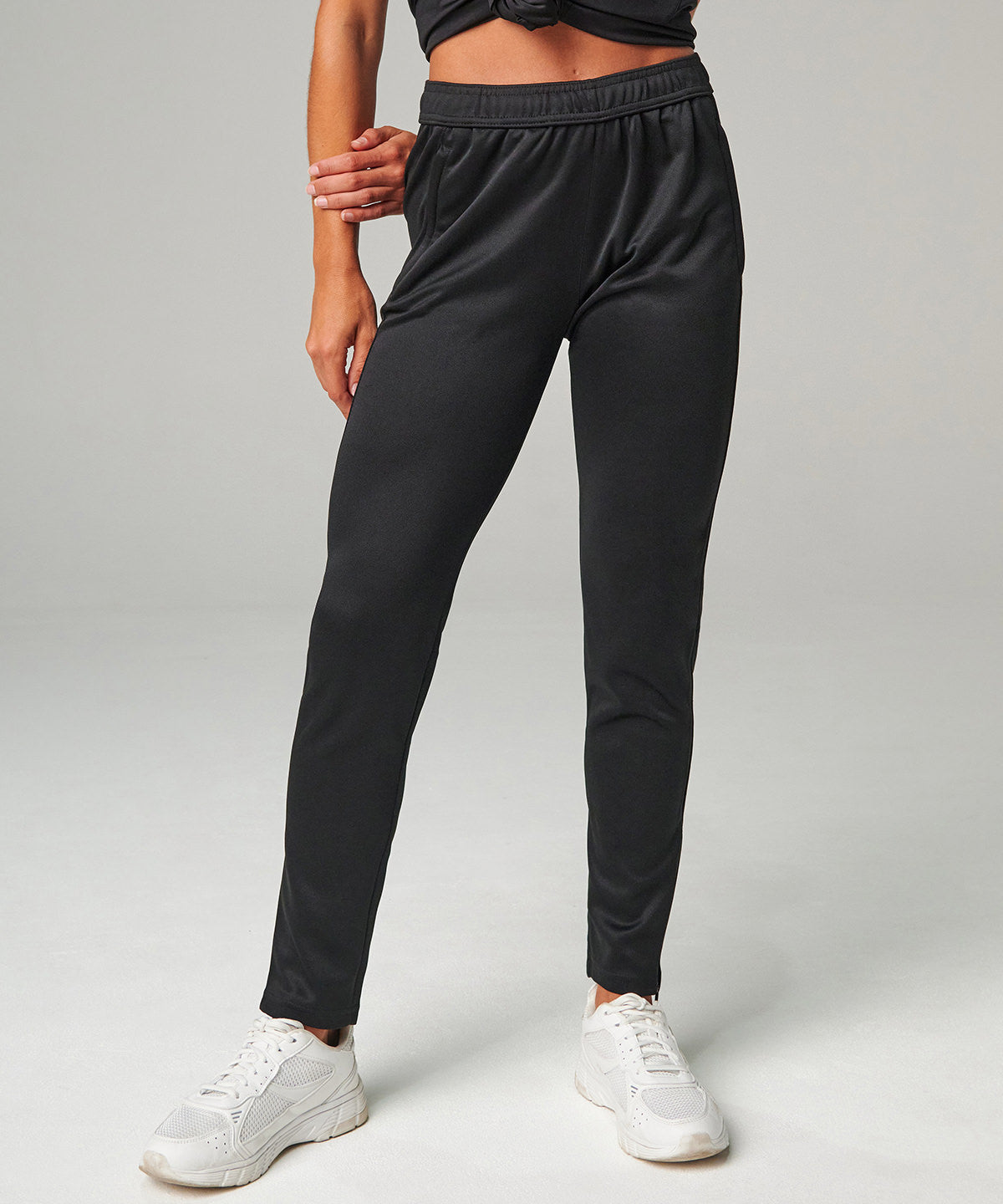 Tombo Women's slim leg jogger in Black, lifestyle photo