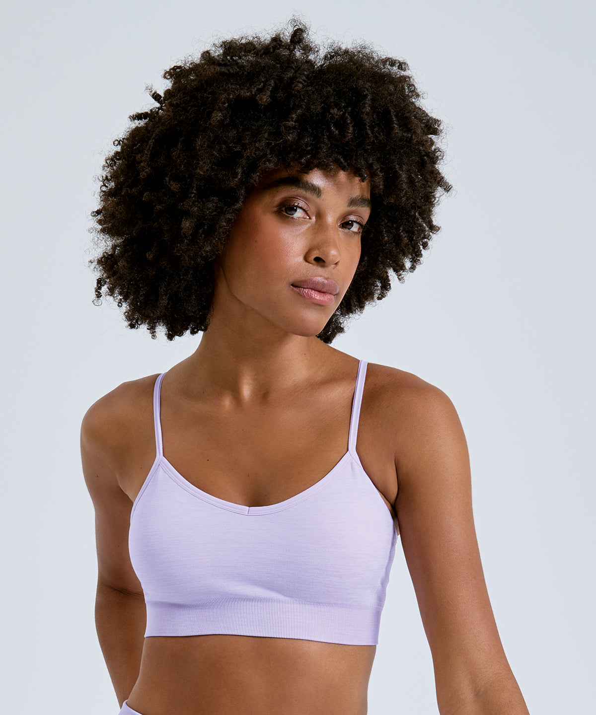 TriDri Women's recycled seamless "3D fit" multi-sport flex bra, lifestyle photo