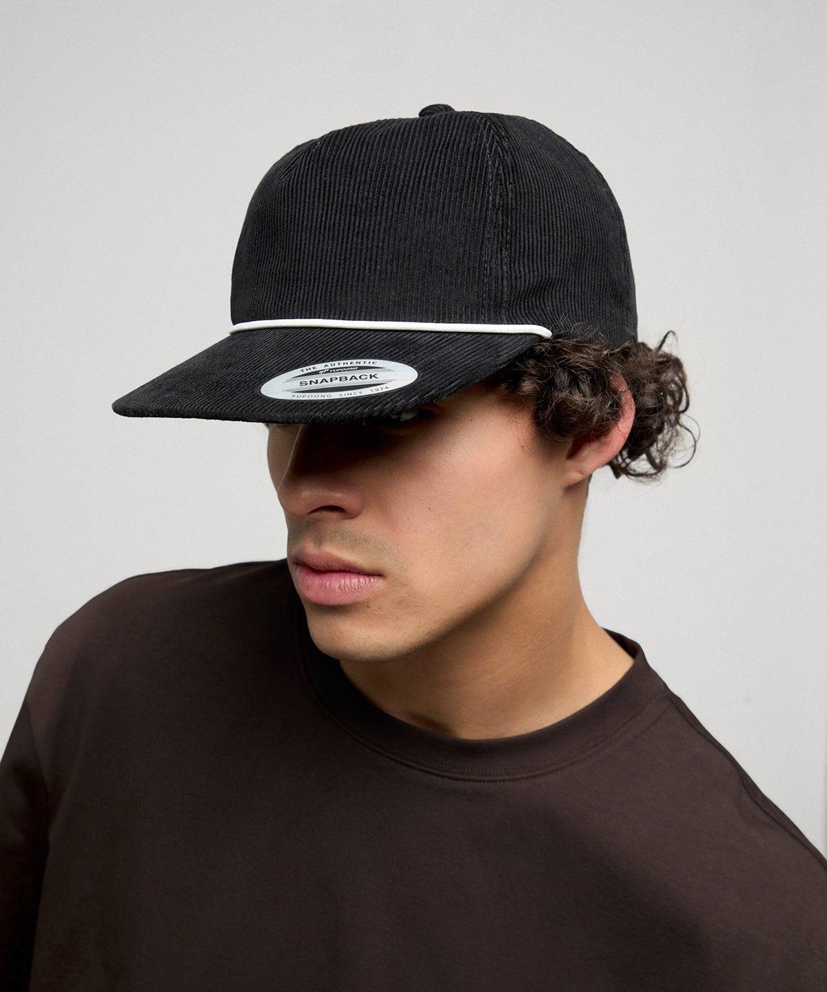Flexfit by Yupoong YP Classics unstructured corduroy cap with braided rope in Black, lifestyle photo