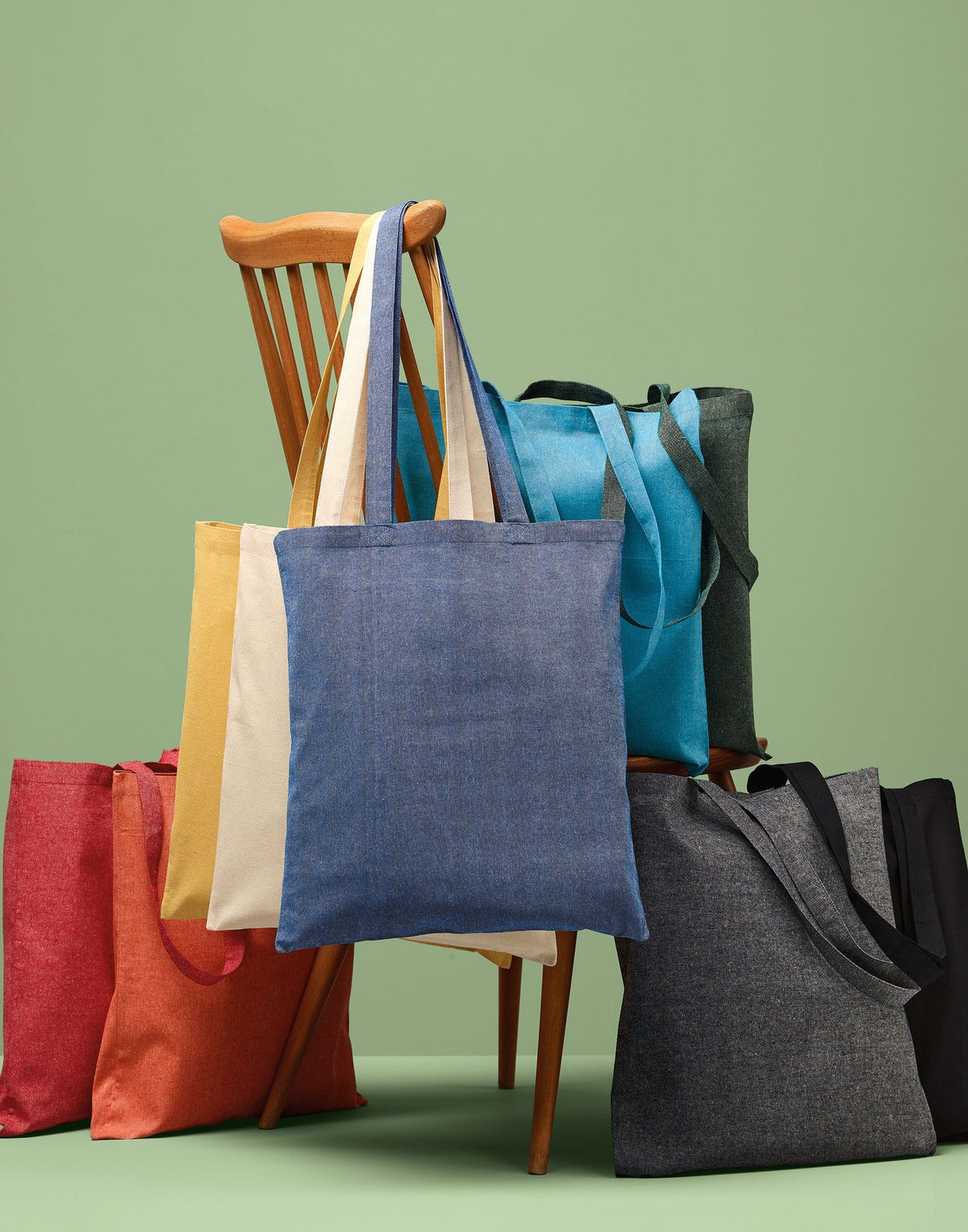Nutshell tote bags hanging from a wooden chair